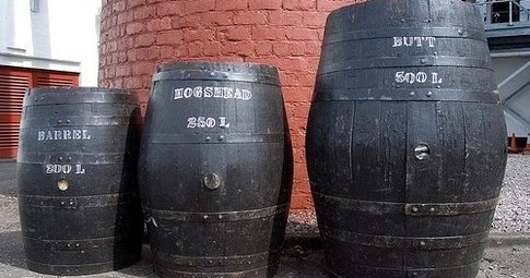 Real whisky casks showing barrel, hogshead and butt at different physical scales