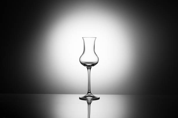 Single clear tasting glass prepared for vodka sensory assessment